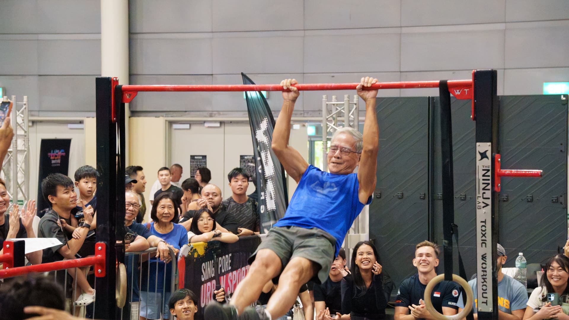 A crowd gathered around an athlete at a recurring community event.