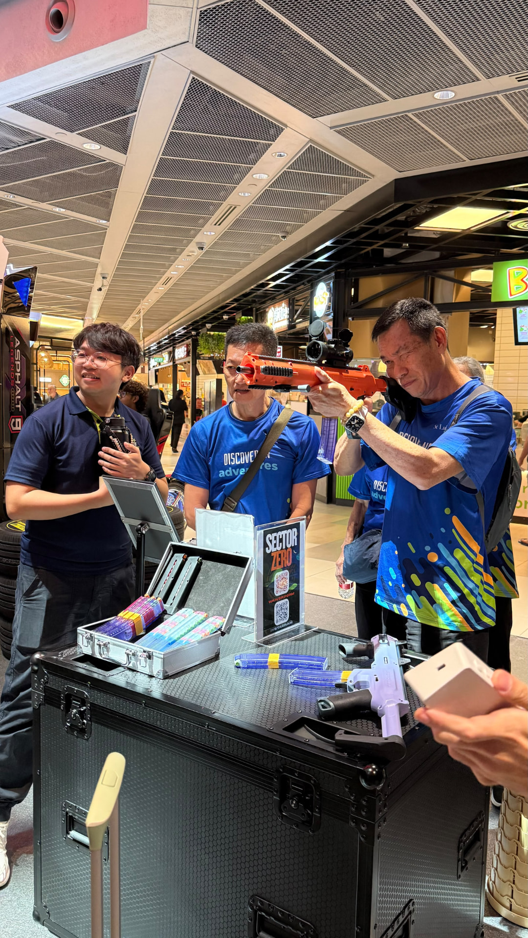 Adults stepping up to try the Sector Strike range together