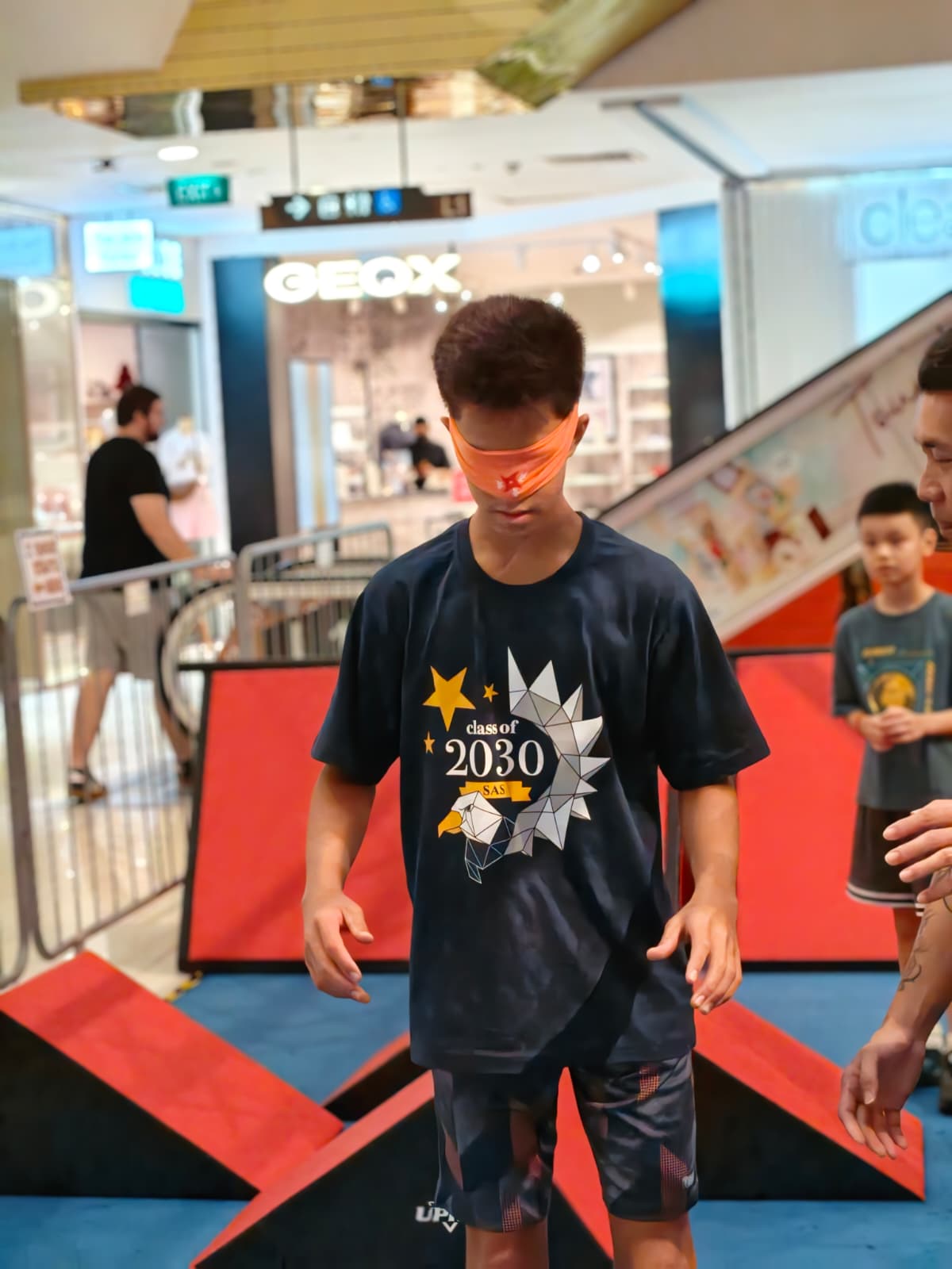 A blindfolded participant taking part in a Shadow Tag challenge
